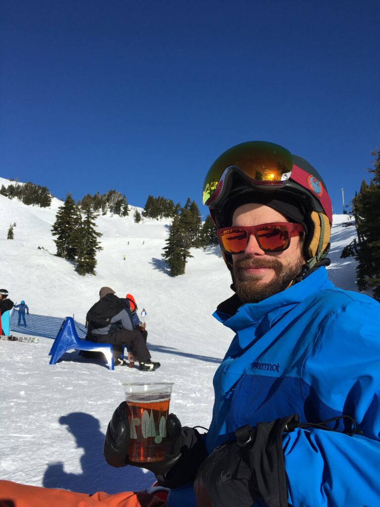 Andy having a beer in the sun at the mid-mountain hut