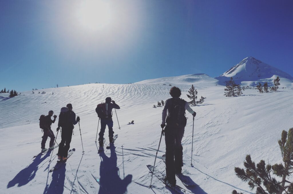 Skiers in an open show field on Mt. Hood