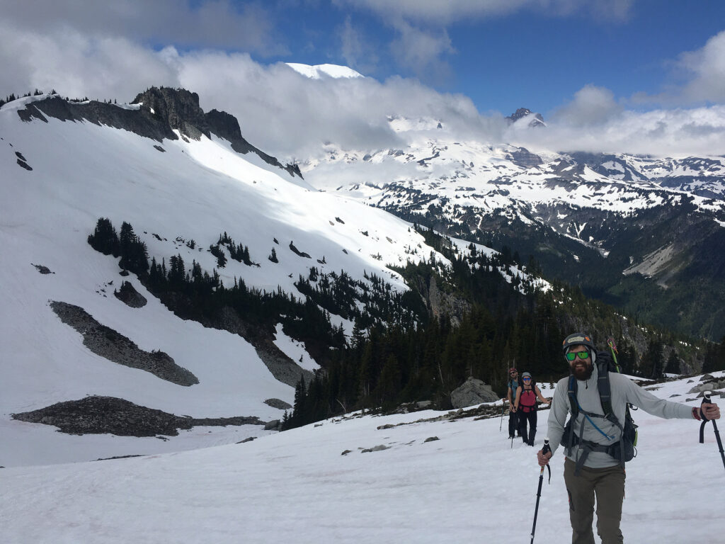 Andy, Nathan, and Katie on the approach to Unicorn in front of Mt. Rainier