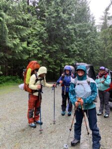 At the trailhead in the rain. I'm wearing a garbage bag over my raincoat.